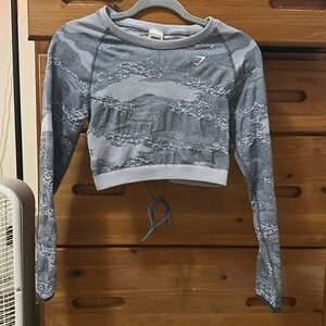 Blue gymshark crop top long sleeve. Size L. Can also fit size M